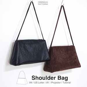 Peut inclure: Deux sacs à bandoulière avec des sangles fines, un noir et un marron foncé. Le texte SEWINGILGI PATTERNS apparaît en haut, et le texte Shoulder Bag A4 / US Letter / A1 / Projector / Tutorial apparaît en bas avec un dessin au trait.