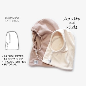 Pode incluir: Dois balaclavas de fleece em bege e creme, com cordões brancos ajustáveis com fechos e pequenas etiquetas de marca. O texto inclui SEWINGILGI PATTERNS, Adults and Kids, A4 / US LETTER, A1 COPY SHOP, PROJECTOR FILE e TUTORIAL.