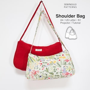 Könnte beinhalten: Zwei Umhängetaschen mit Reißverschluss und Etiketten mit der Aufschrift LOVE YOU. Eine Tasche ist aus rotem Kord, die andere hat einen weißen Hintergrund mit einem bunten botanischen Druck aus Blumen und Hasen. Text: SEWINGILGI PATTERNS.