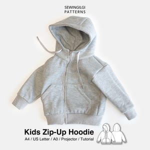 May include: A light gray zip-up hoodie for kids featuring a hood with white drawstrings, long sleeves with ribbed cuffs, a ribbed hem, and two front pockets. The text SEWINGILGI PATTERNS and Kids Zip-Up Hoodie A4 / US Letter / A0 / Projector / Tutorial is visible.