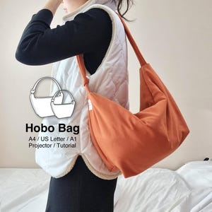 May include: A solid burnt orange hobo bag with a single shoulder strap and a knotted detail. The bag is displayed alongside a graphic illustration of two hobo bag outlines with the text Hobo Bag A4 / US Letter / A1 Projector / Tutorial.