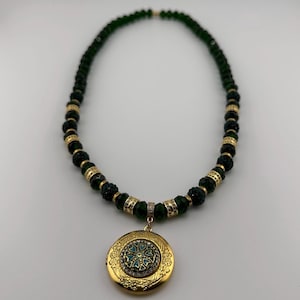 Green and gold bead necklace with photo locket