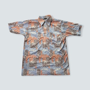 Vintage grand slam by munsingwear  penguin all over print 1970s disco 70s disco polyester shirt print inspiration