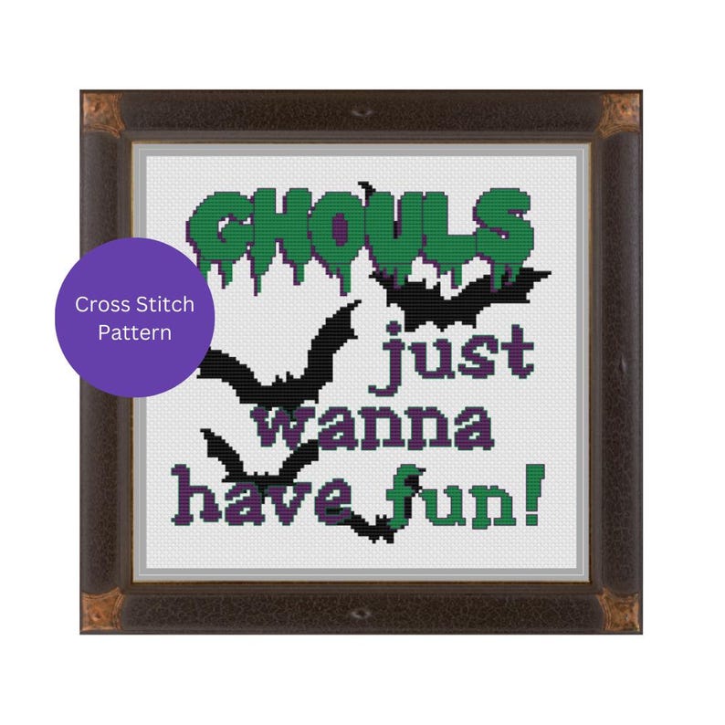 May include: Cross stitch pattern with the text "Ghouls just wanna have fun!" in green and purple lettering. The design features four black bats with purple accents.