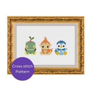 May include: Cross-stitch pattern featuring three cartoon characters: a green plant-like creature, an orange monkey-like figure, and a blue penguin. The artwork is framed in a gold ornate frame. A purple circle with the text "Cross stitch Pattern" is in the lower left corner.