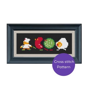 Könnte beinhalten: Kreuzstichmuster in einem dunkelblauen rechteckigen Rahmen. Das Kreuzstichdesign zeigt pixelige Bilder eines Kochs, einer roten Paprika, eines grünen Balls und eines Spiegeleis. Der Text "Cross stitch Pattern" befindet sich auf einem lila Kreis.