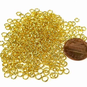 5  Grams of Gold Tone Plated Open Jump Rings 4mm 21ga (No.GR2349)