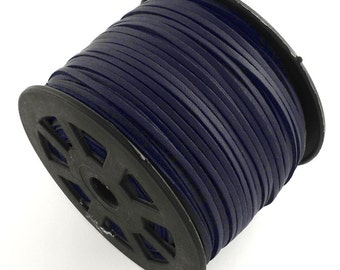 May include: A spool of dark blue leather cord. The cord is wound tightly around a black plastic spool.