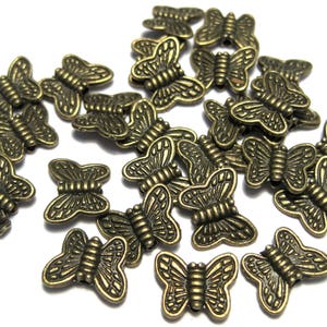 20 Antique Bronze Butterfly Spacer Beads: 10x8mm Alloy Charms