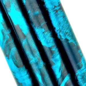 Dark Matter, custom bespoke pen blanks. Pressure cured Alumilite resin mixed with mottled black pigment, mirror teal flake & translucent