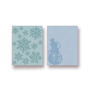 May include: Two light blue rectangular cards. One card features embossed snowflakes, the other a snowman with snowflakes. The snowman wears a top hat and has a snowflake body. Winter holiday theme.