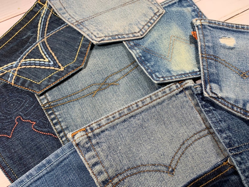 May include: A patchwork of different denim fabrics, each with unique stitching and wear patterns. The fabrics are arranged in a random pattern, creating a visually interesting and textured surface.