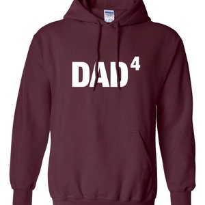 May include: Burgundy hooded sweatshirt with white text that reads "DAD4".