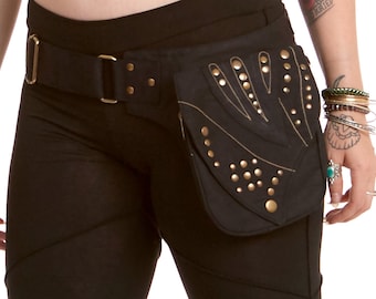 May include: Black leggings with lace panels and a black canvas belt with a studded pouch. The pouch has a hand design and a zipper closure.