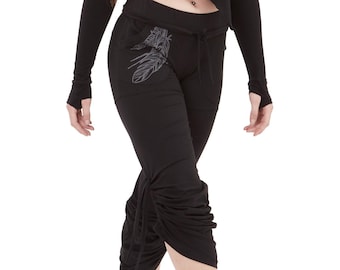 May include: Black cropped top and black pants with a drawstring waist and a gathered detail at the bottom of the legs. The pants have a gray leaf design on the left side.