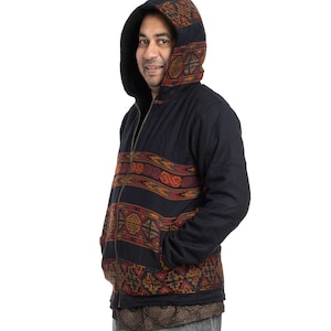 May include: A black hooded jacket with a colorful geometric pattern. The jacket has a zipper closure and two pockets.