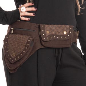 May include: Brown waist bag with multiple pockets and a geometric pattern. The bag has a zippered pocket and is adorned with metal studs. The belt is adjustable.