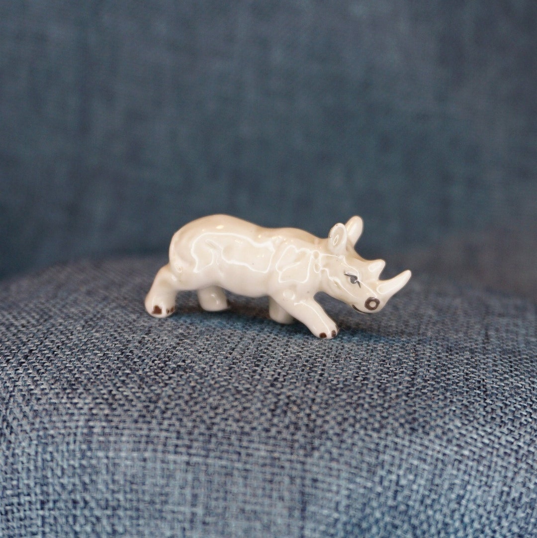 Miniature Rhinoceros Figurine. Tiny Bone China Running Rhino Figure