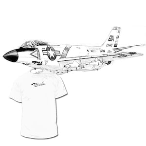 May include: A black and white sketch of a US Navy F-8 Crusader jet fighter plane. The plane has a star on the side and the text "US Navy" on the tail.
