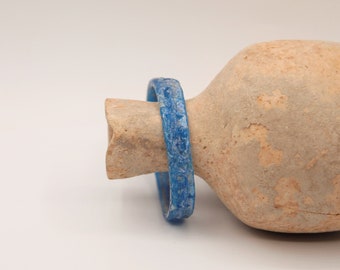 A Roman glass bangle bracelet, c.1st-4th Century AD, translucent turquoise blue