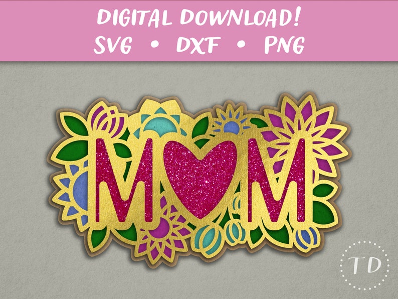 May include: Gold glitter MOM lettering with a pink glitter heart in the center, surrounded by colorful floral designs.