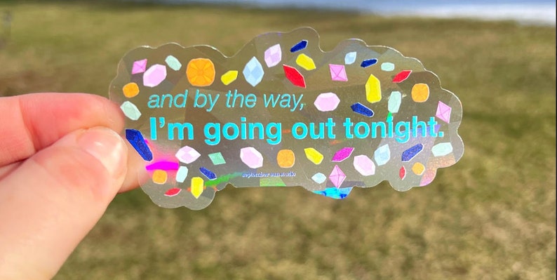 May include: A clear sticker with a colorful confetti design and the text "and by the way, I'm going out tonight."