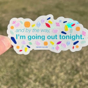 May include: A white sticker with a holographic finish and colorful confetti-like shapes. The sticker says "and by the way, I'm going out tonight."