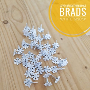25 pcs Fermacampioni fiocco di neve bianco 12x14mm