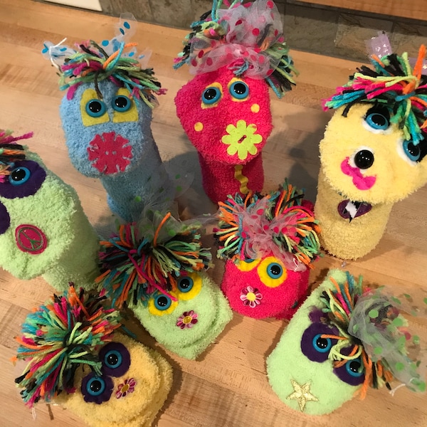 Sock puppets made from fuzzy socks. Great for puppet shows, dramatic play and gifts!