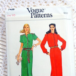 May include: Vogue Patterns sewing pattern number 7426, size 10, for a dress with two variations. The dress on the left is green with a belt and the dress on the right is red with a belt. The pattern is priced at $3.50.