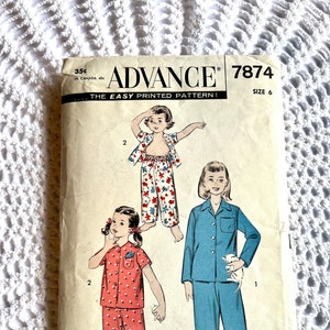 May include: Vintage Advance sewing pattern for children's pyjamas, size 6. The pattern envelope features illustrations of pyjama sets in red, blue, and floral prints. The text on the envelope reads "ADVANCE" and "THE EASY PRINTED PATTERN!"