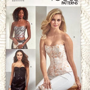 May include: Vogue Patterns V1876 sewing pattern envelope for a strapless corset top in sizes 8-16. The cover displays three variations of the corset: a silver metallic version, a solid black version, and a floral patterned version in peach and white.