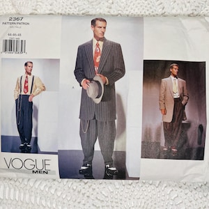 May include: A Vogue Men sewing pattern envelope, number 2367, featuring illustrations of suits with pinstriped trousers, jackets, and ties. The package displays sizes 44-46-48 and includes a barcode. The imagery shows various formal outfits.