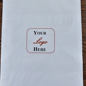 May include: A white envelope with a red border around a square that says "YOUR Logo HERE" in black text.