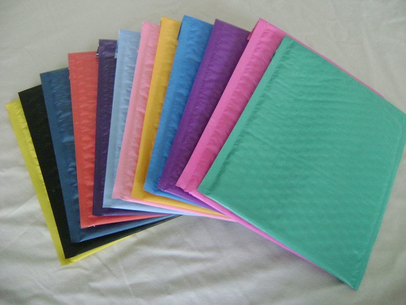 May include: A variety of colorful bubble mailers, including black, blue, red, pink, yellow, purple, and teal.