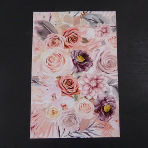 May include: A floral print featuring pink, white, and purple roses, dahlias, and other flowers on a white background.