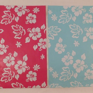 May include: Two sheets of wrapping paper with a white hibiscus flower pattern. One sheet is pink and the other is light blue.