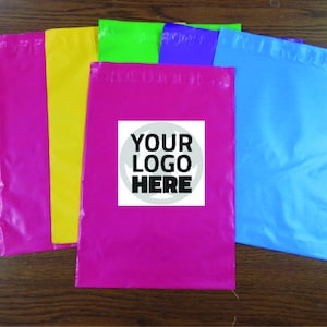 May include: Five colorful plastic mailing envelopes with a white label that says "YOUR LOGO HERE". The envelopes are pink, yellow, green, blue, and purple.