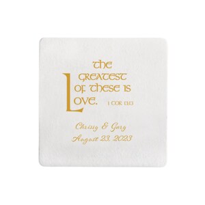 May include: White square coaster with gold lettering. The text reads "the GREATEST of these is LOVE. 1 COR 13:13" and "Chrissy & Gary August 23, 2023".