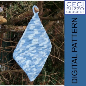 May include: A blue and white crocheted pot holder with a loop handle hanging from a tree branch. The text "DIGITAL PATTERN" is on the right side of the image.