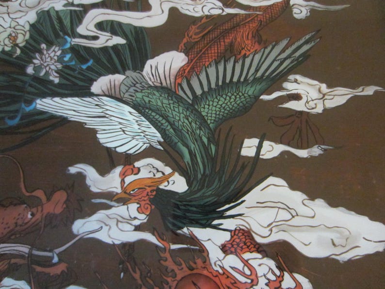 May include: A detailed illustration featuring a green and white phoenix in flight amidst stylized white clouds on a brown background. A red dragon with a scaly body is partially visible at the bottom, alongside white floral elements.