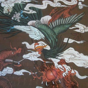 May include: A detailed illustration on a brown background featuring a green and white phoenix with long tail feathers flying above a red dragon. The dragon has a long body and scales, and both creatures are surrounded by stylized white clouds.
