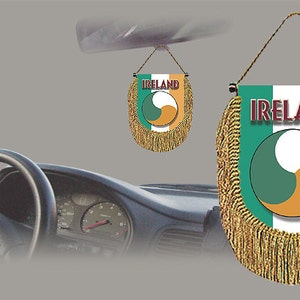 May include: A gold fringed car hanging ornament with the Irish flag and the word "IRELAND" printed on it.