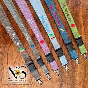 Assortment of breakaway safety lanyards made from a linen cotton blend fabric. Personalized with embroidery in a variety of fabric colors and embroidered icons.