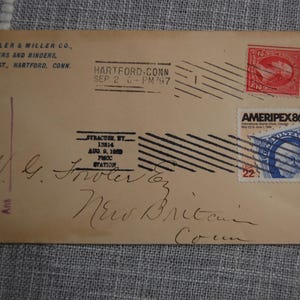 May include: An antique envelope with stamps and postmarks. The envelope is addressed to G. Fowler, New Britain, Conn. The stamps include a red stamp and a blue stamp with the text "AMERIPEX86". The envelope is dated September 3, 1897.