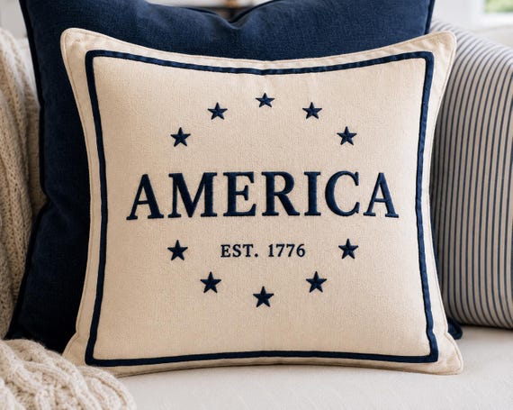 America est. 1776 Embroidered pillow in patriotic cream and navy Americana style