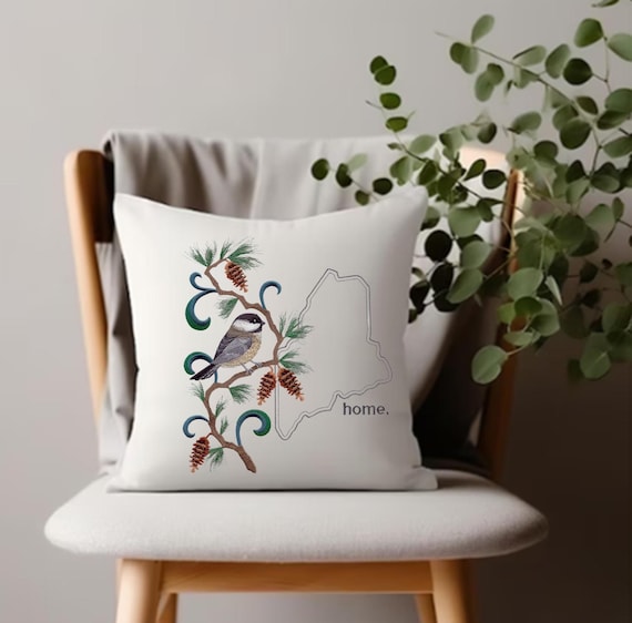 Maine Chickadee and Pinecone medley. Embroidered with feather insert