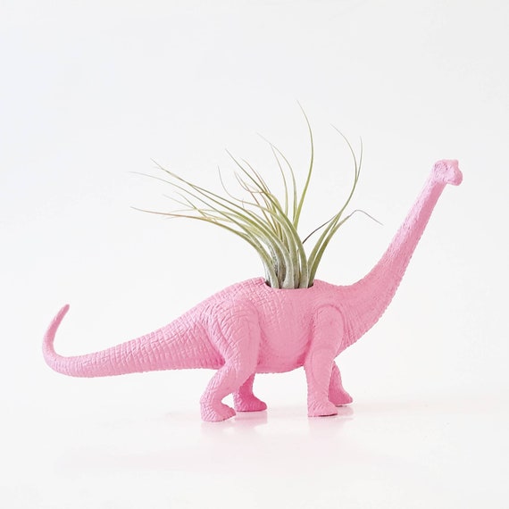 pink plastic dinosaur