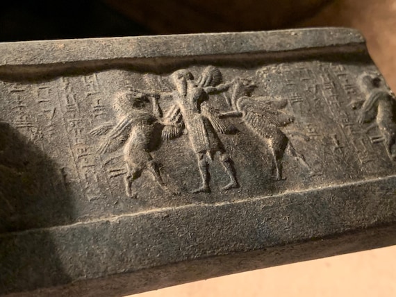 Mesopotamia Assyrian cylinder seal impression - Annunaki / Apkallu / Hero wrestling winged griffins