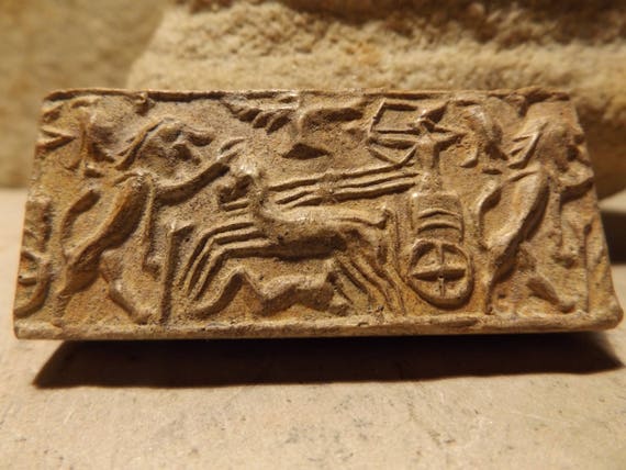 Cylinder seal impression from ancient Ugarit - Syria, Levant, Mesopotamia. An early depiction of the chariot.